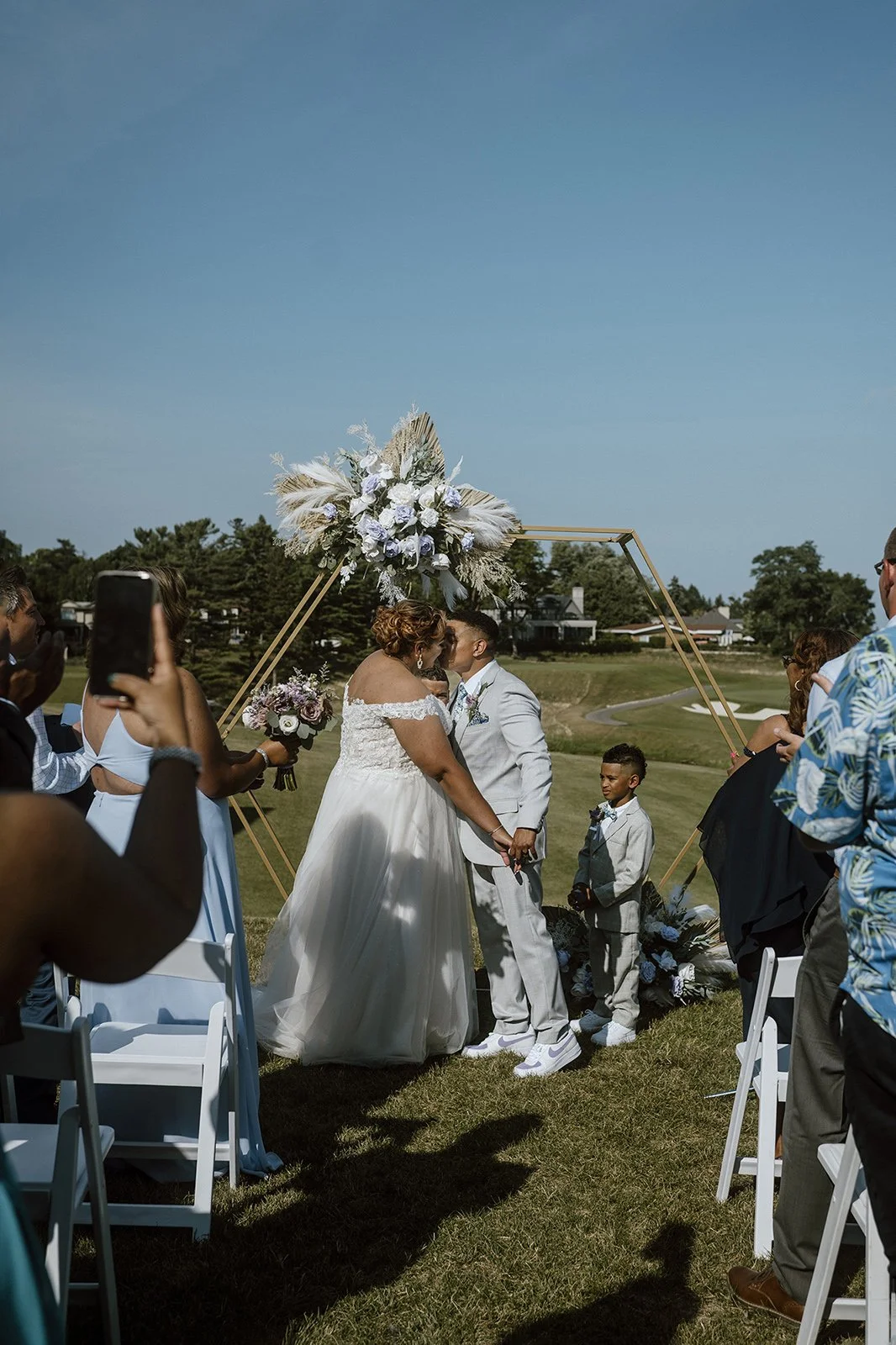 Small vow renewal ceremony in an open field in Toronto
