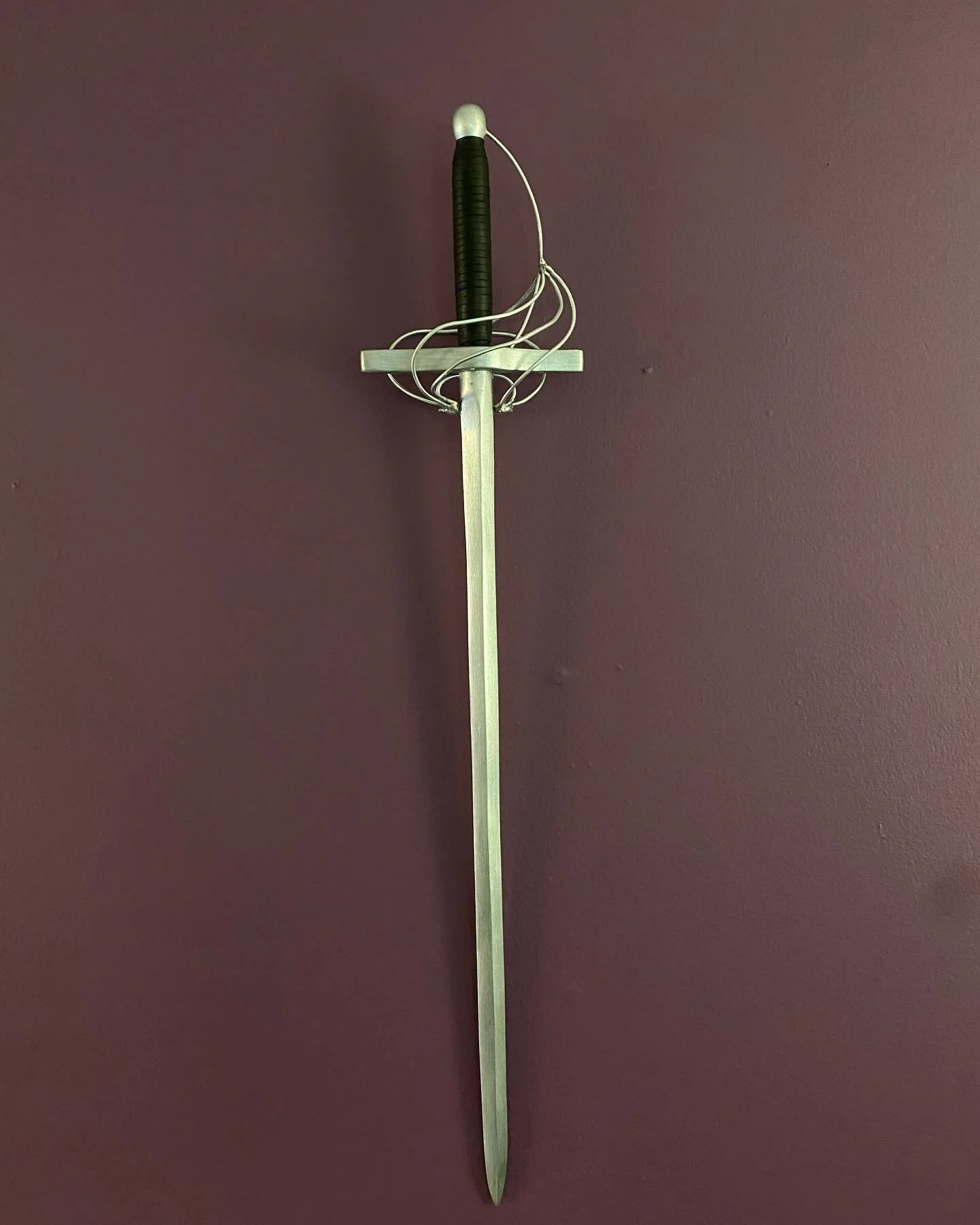 En guard! This wooden sword was created to accompany a costume for Ren Faire! The handle is wrapped with leather and the guard is made with steel wire. Interested in bringing props, accessories, or ideas to life? Reach out for a free custom consultat