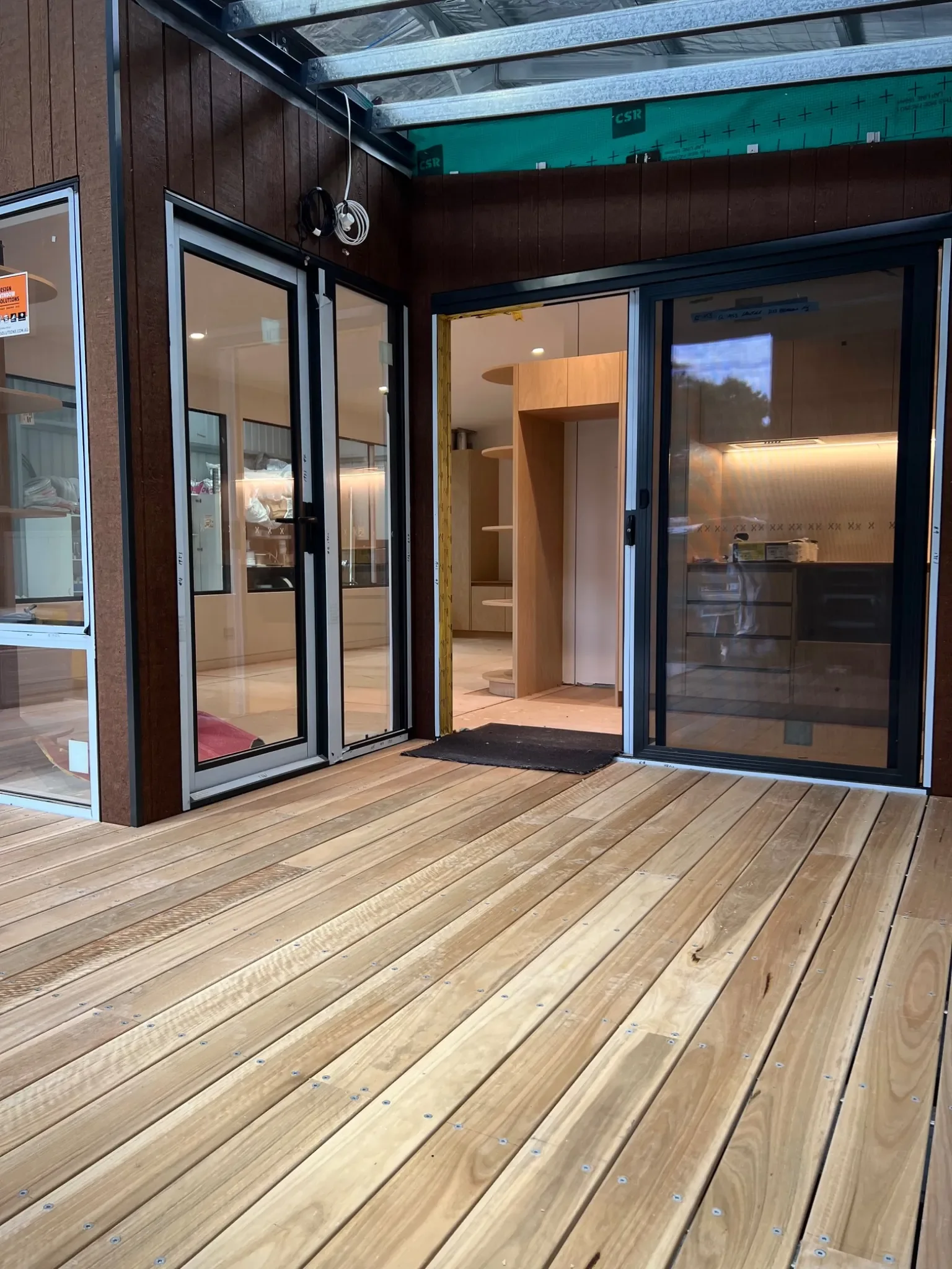 Frontier.Life modular granny flat under construction in Castlemaine Victoria with timber deck and large sliding doors.