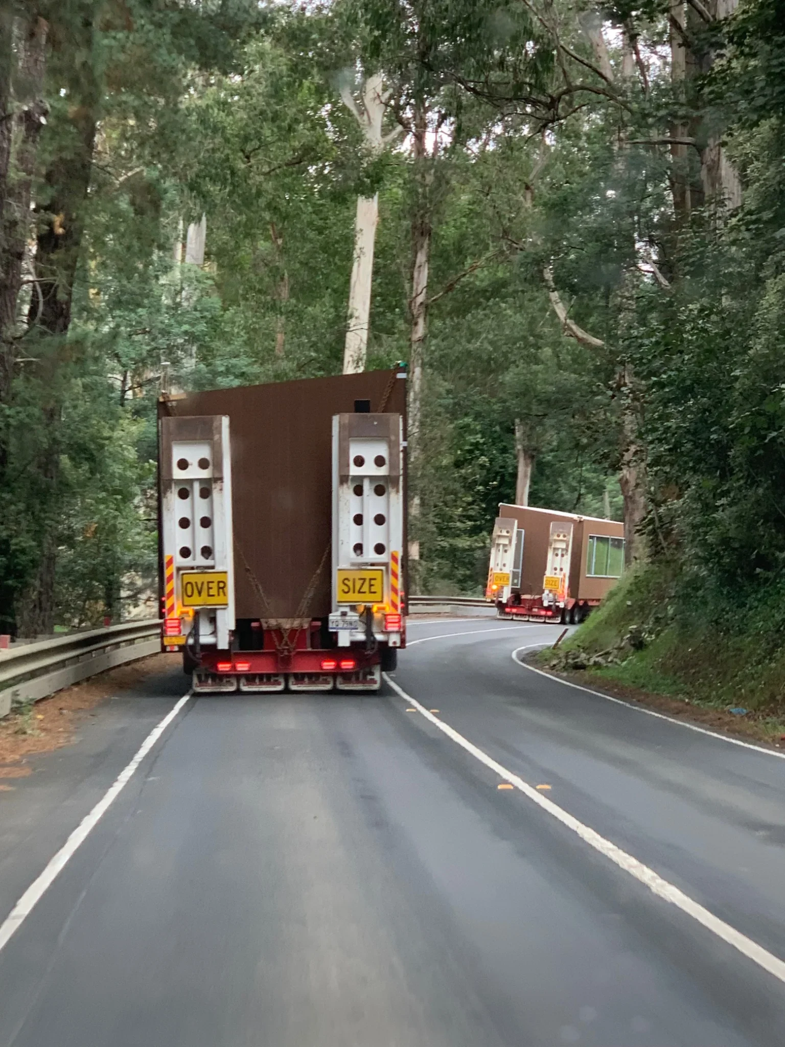 Modular home being transported through bushland road near Castlemaine, Victoria
