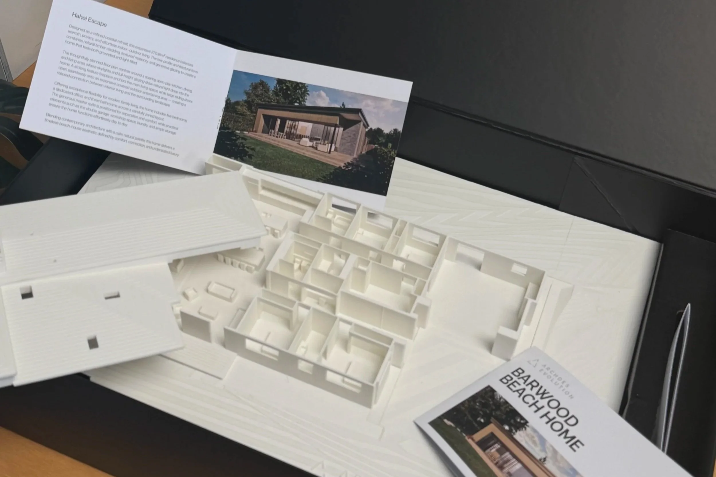 Architectural model of a building and an information brochure for Barwood Beach House.