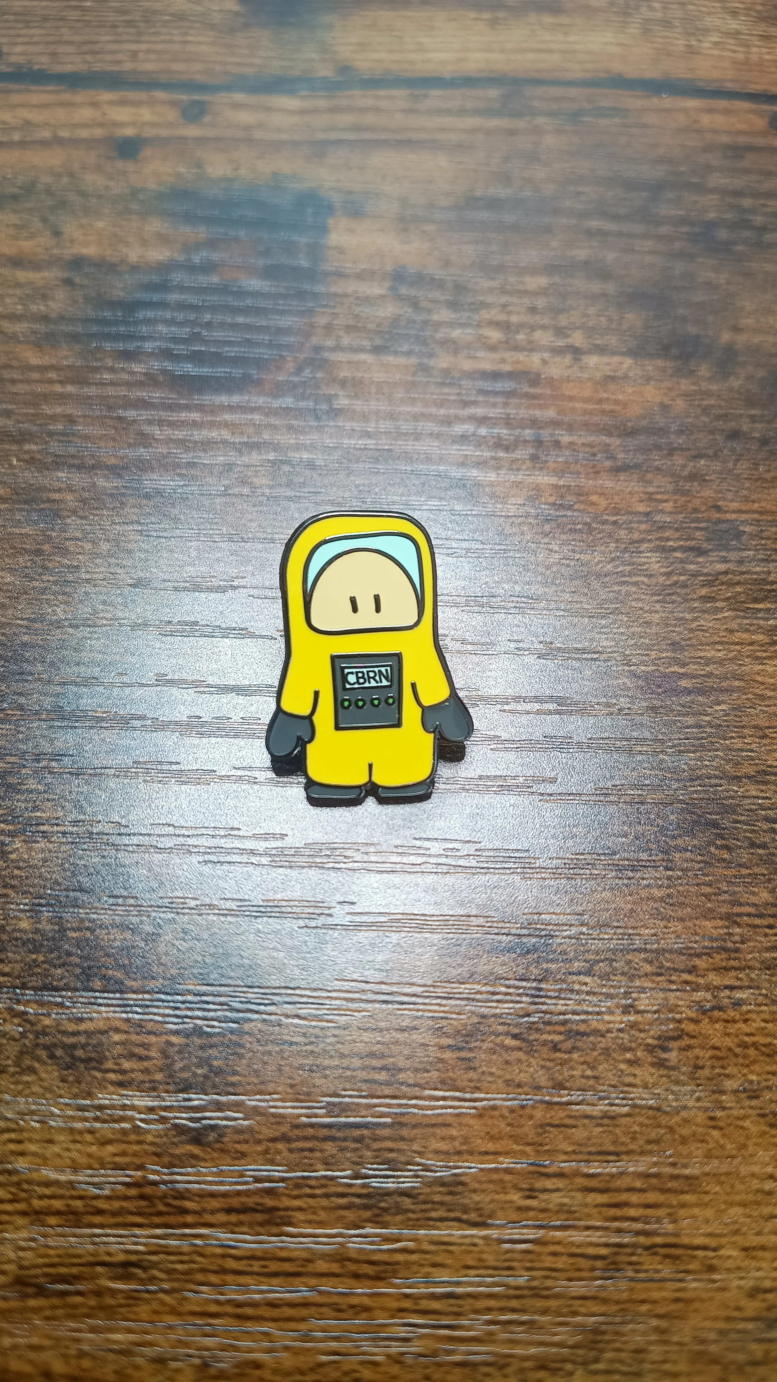 Dave the CBRN Guy 1 inch hard enamel pin with a safety clutch.