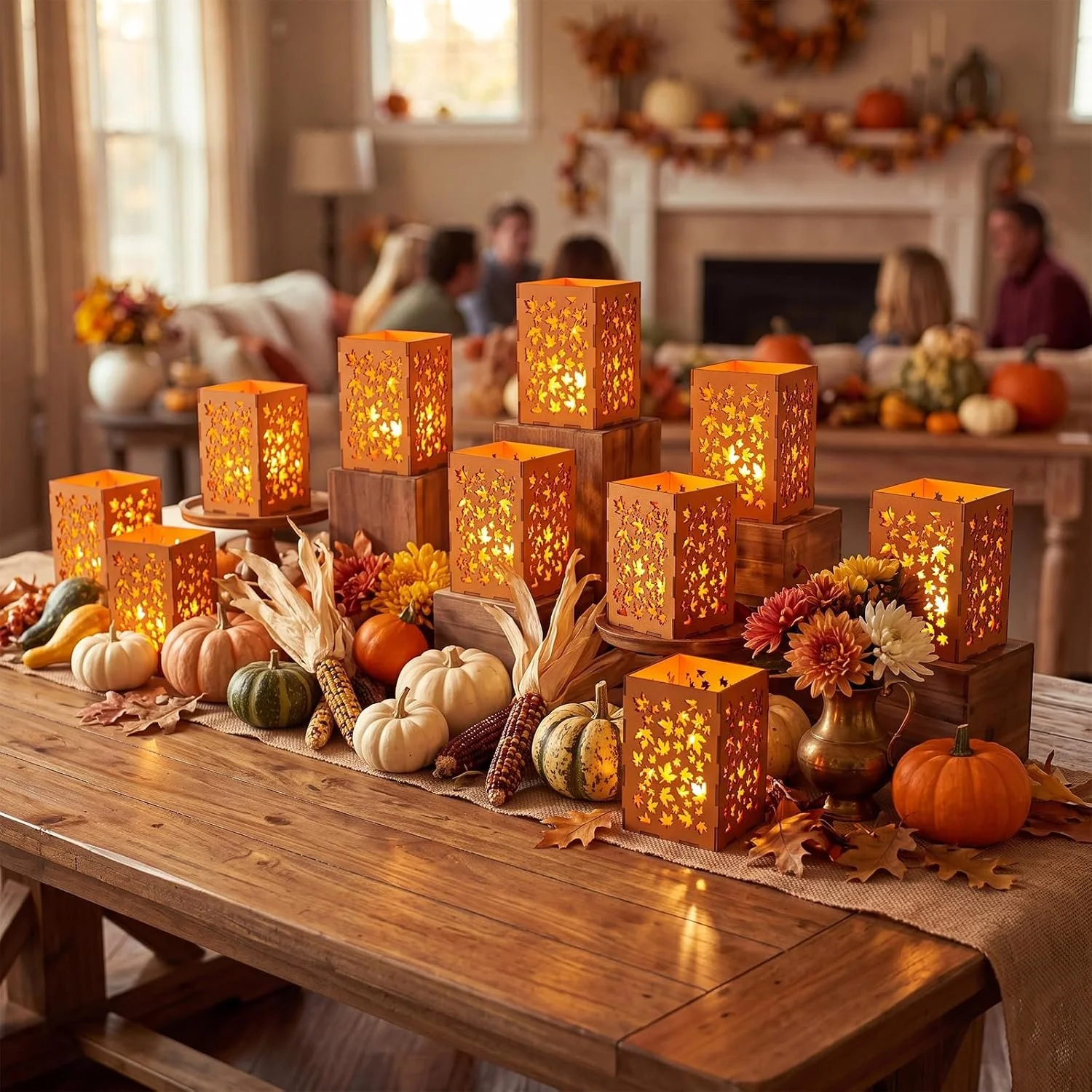Thanksgiving table centerpiece with orange lanterns, pumpkins, gourds, and autumn flowers on a wooden table in a decorated living room.