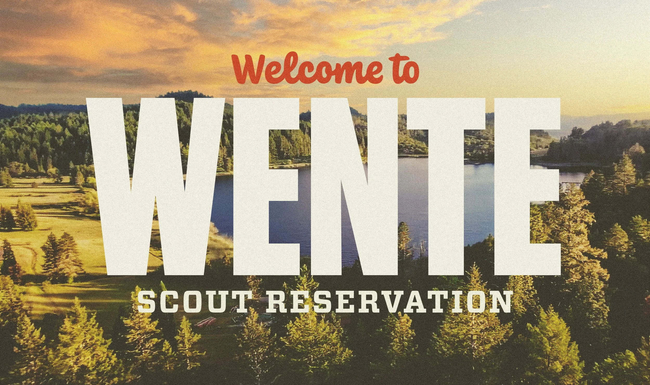 Ariel view of a lake at sunset with the words " Welcome to Wente Scout Reservation" superimposed on top.