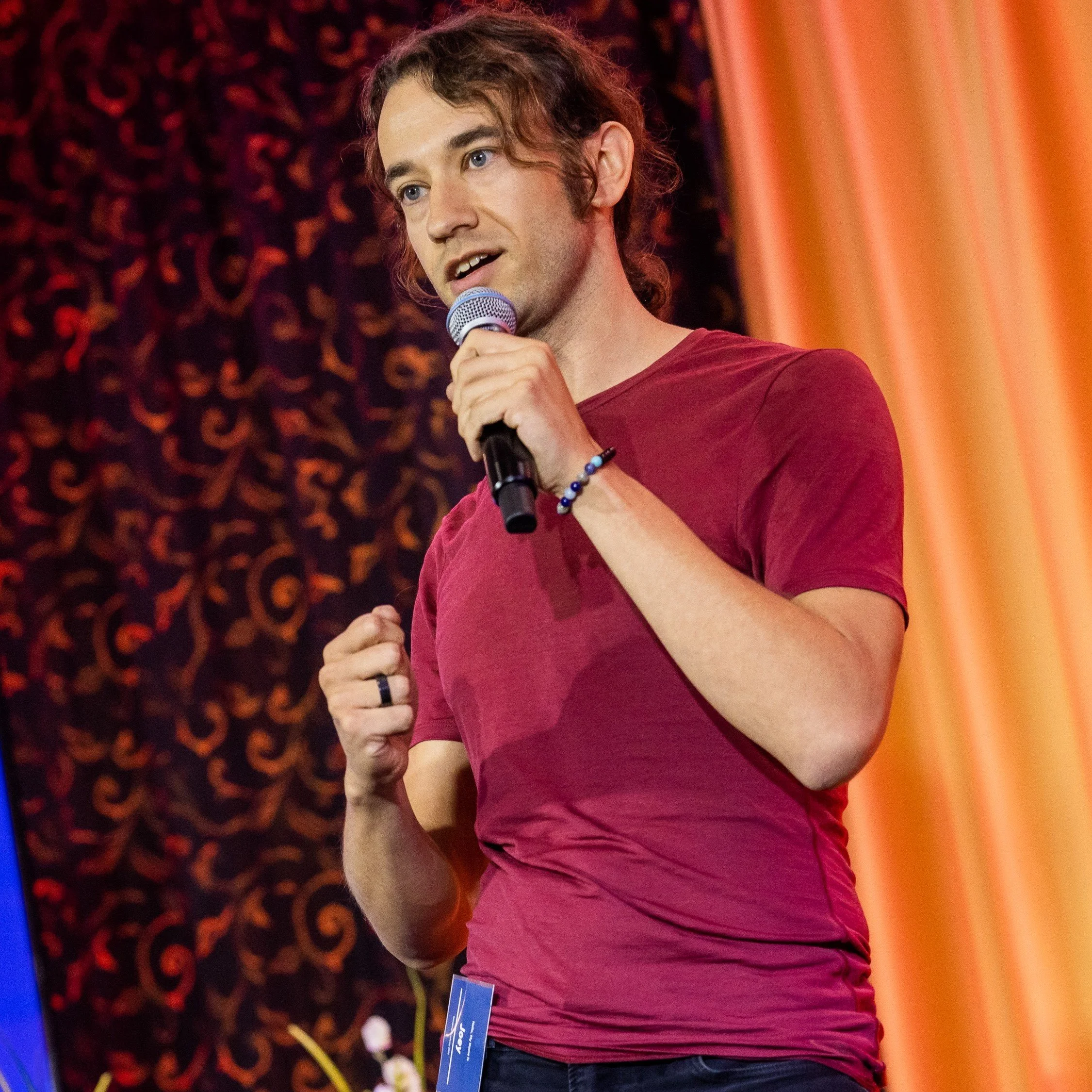 Joey speaking on stage