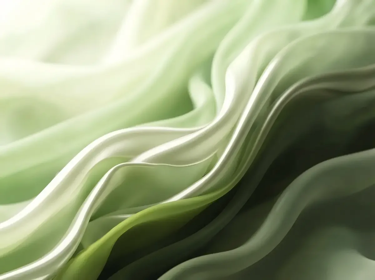 Close-up shot of a green silky, layered and smooth texture to symbolize the arrival of spring season.