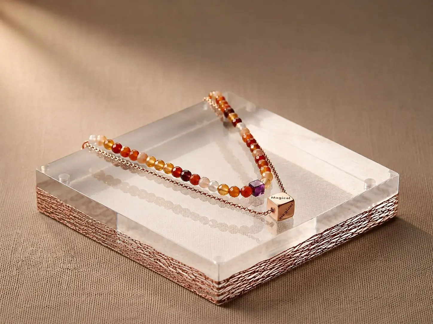 Scented emotions autumn diffuser double strands necklace, with semi precious stones and meaningful words engraved on pendant. showcased on a autumn color-theme display to remind you to slow down, relax. .