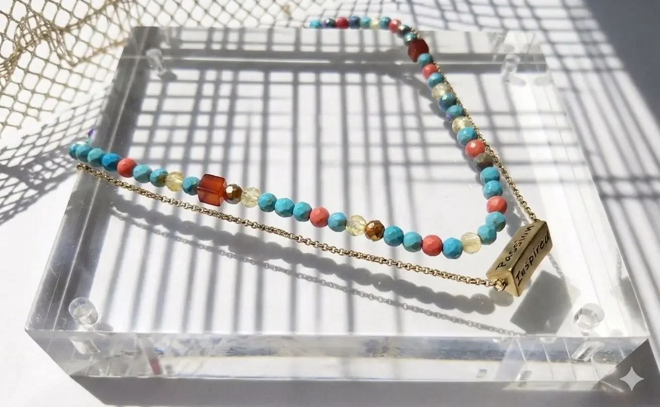 Scented emotions summer diffuser double strands necklace, with semi precious stones and meaningful words engraved on pendant. showcased on a summer color-theme display to remind you to have passion and to chase your dreams