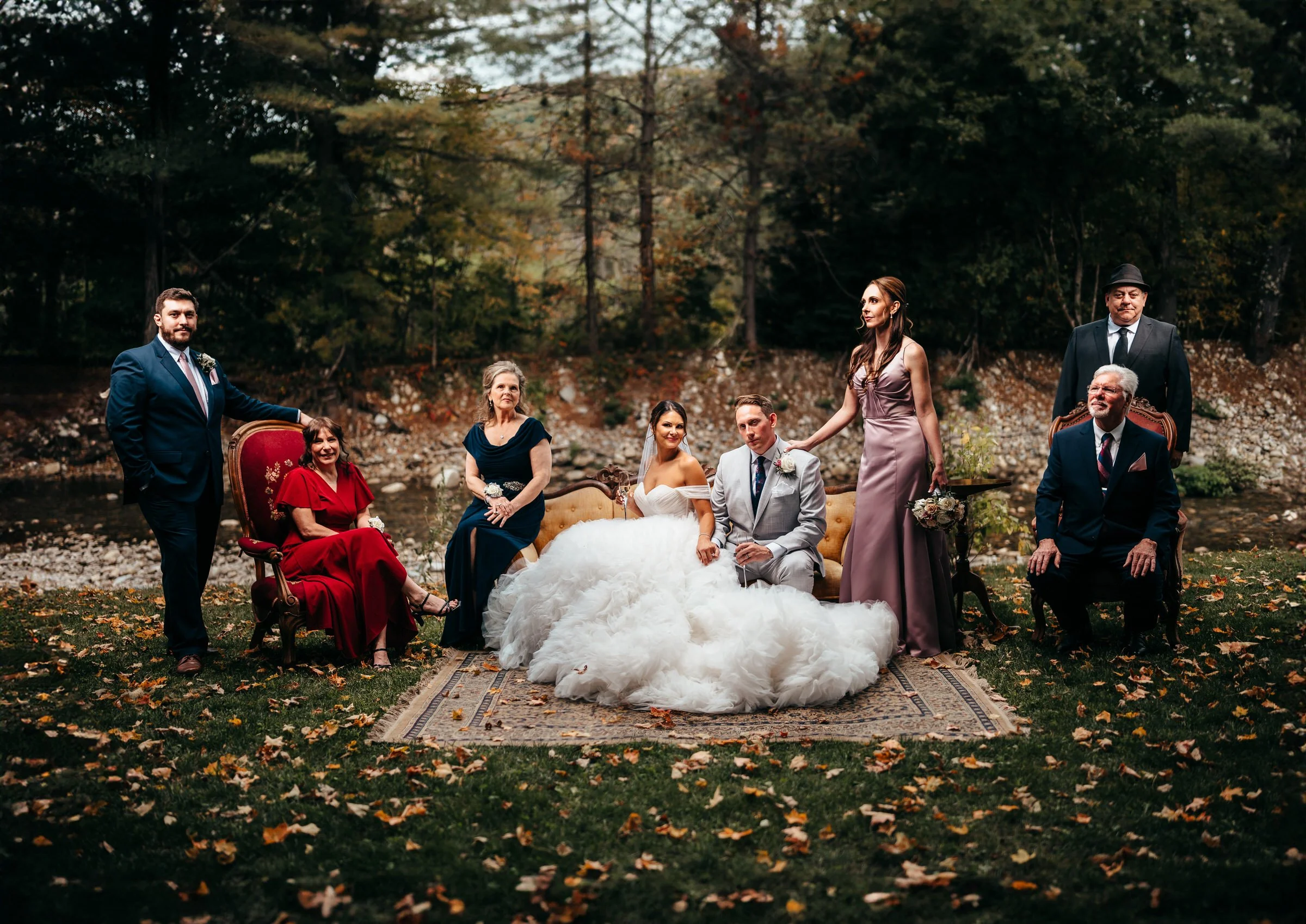 Wedding party group portrait outdoors in autumn