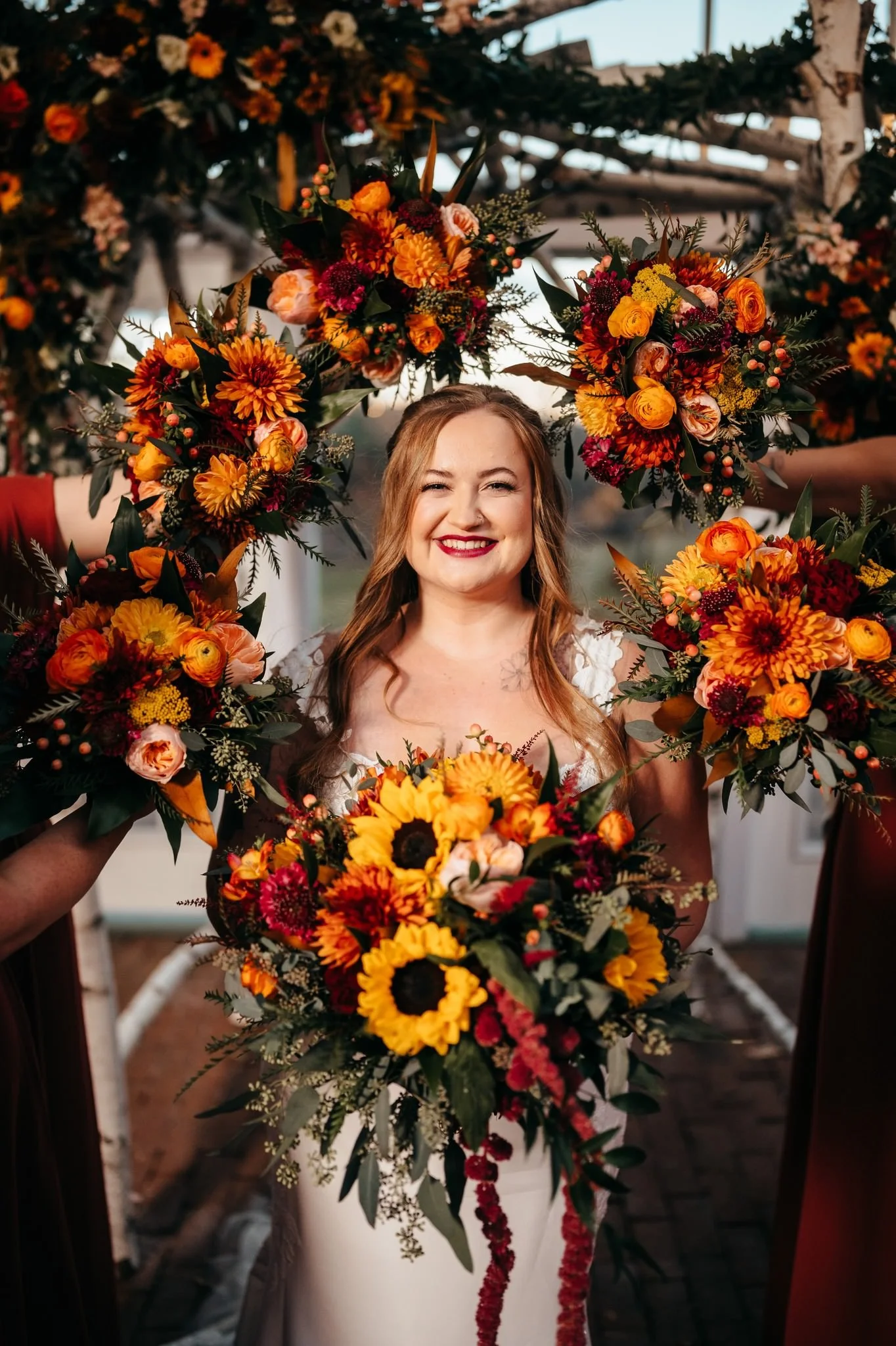 Smiling bride with bouquets