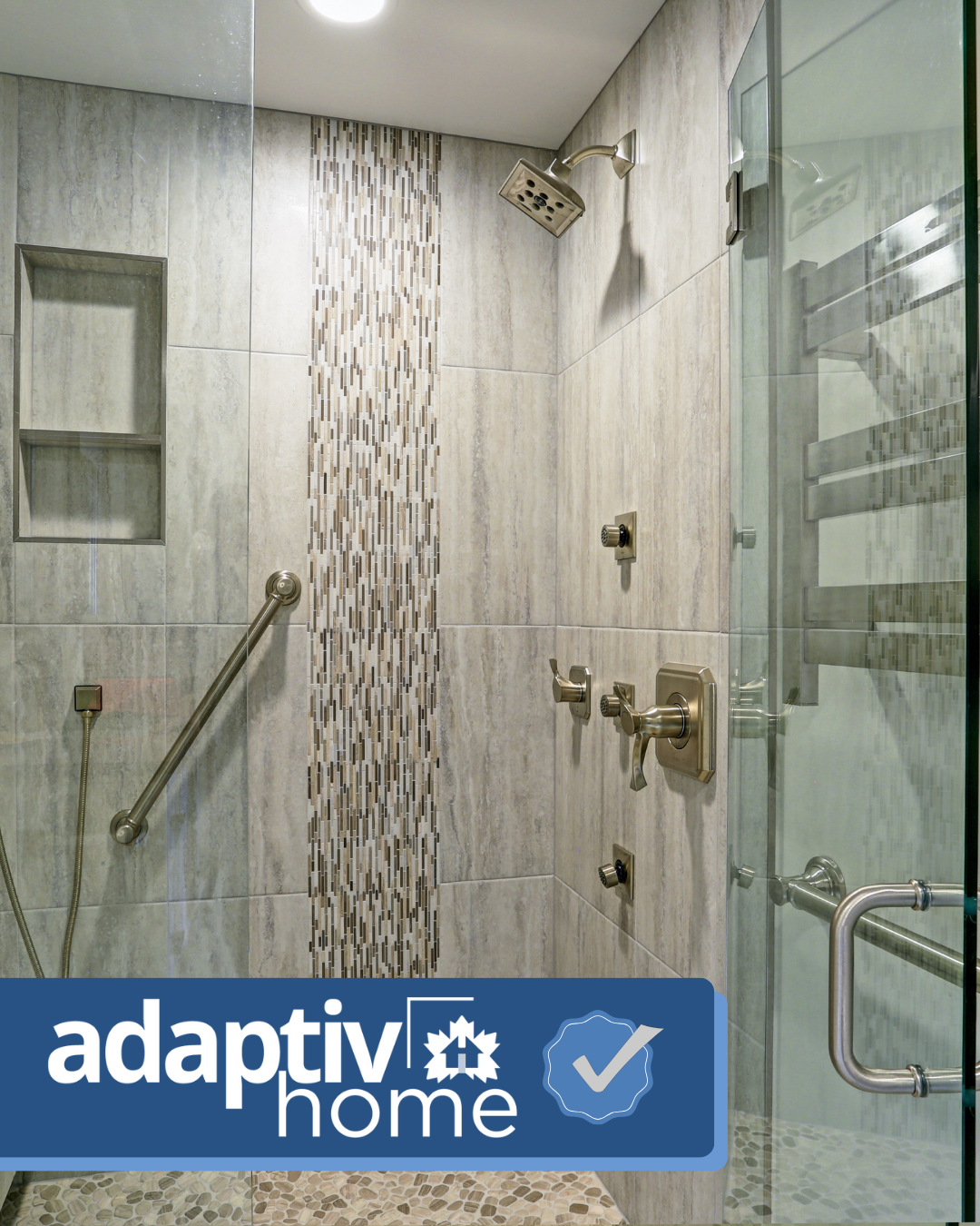 Accessible shower with grab bar, handheld showerhead, and tiled interior