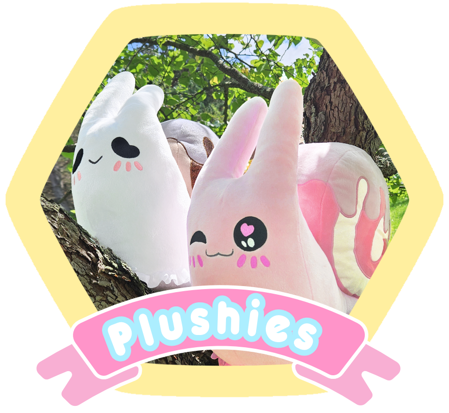 Four plush bunny toys with cute faces and blushing cheeks, sitting on tree branches with green leaves in the background, framed by a yellow hexagon with a pink banner reading 'Plushies'.