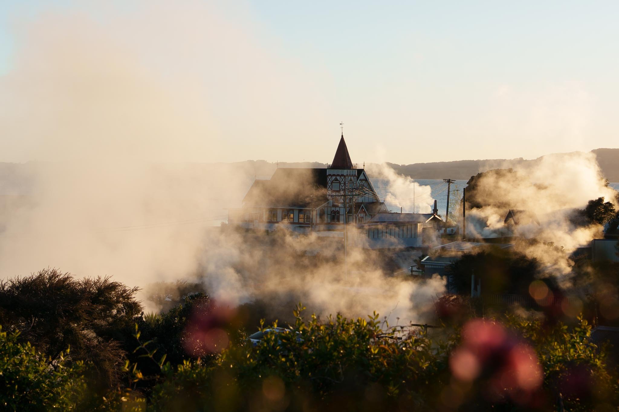 Steam rises around a building in Rotorua