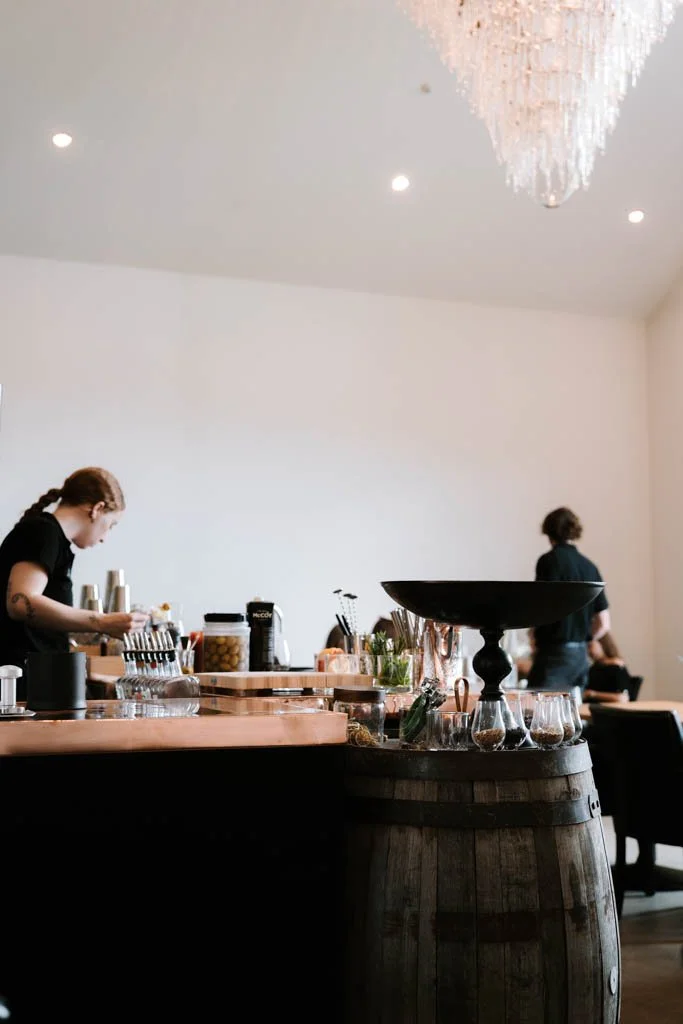 A bartender makes cocktails at the whisky distillery in Cardrona
