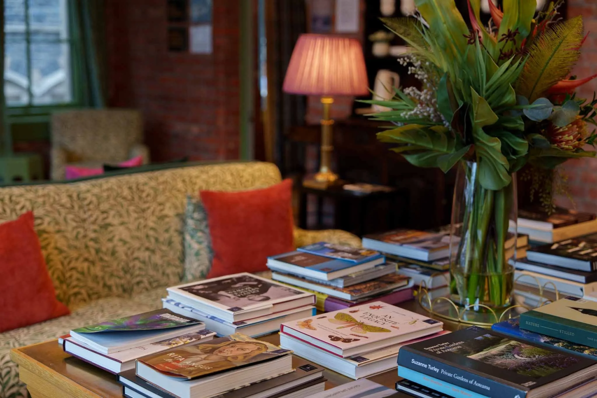 Books are stacked on a table in the lounge at the Observatory Hotel
