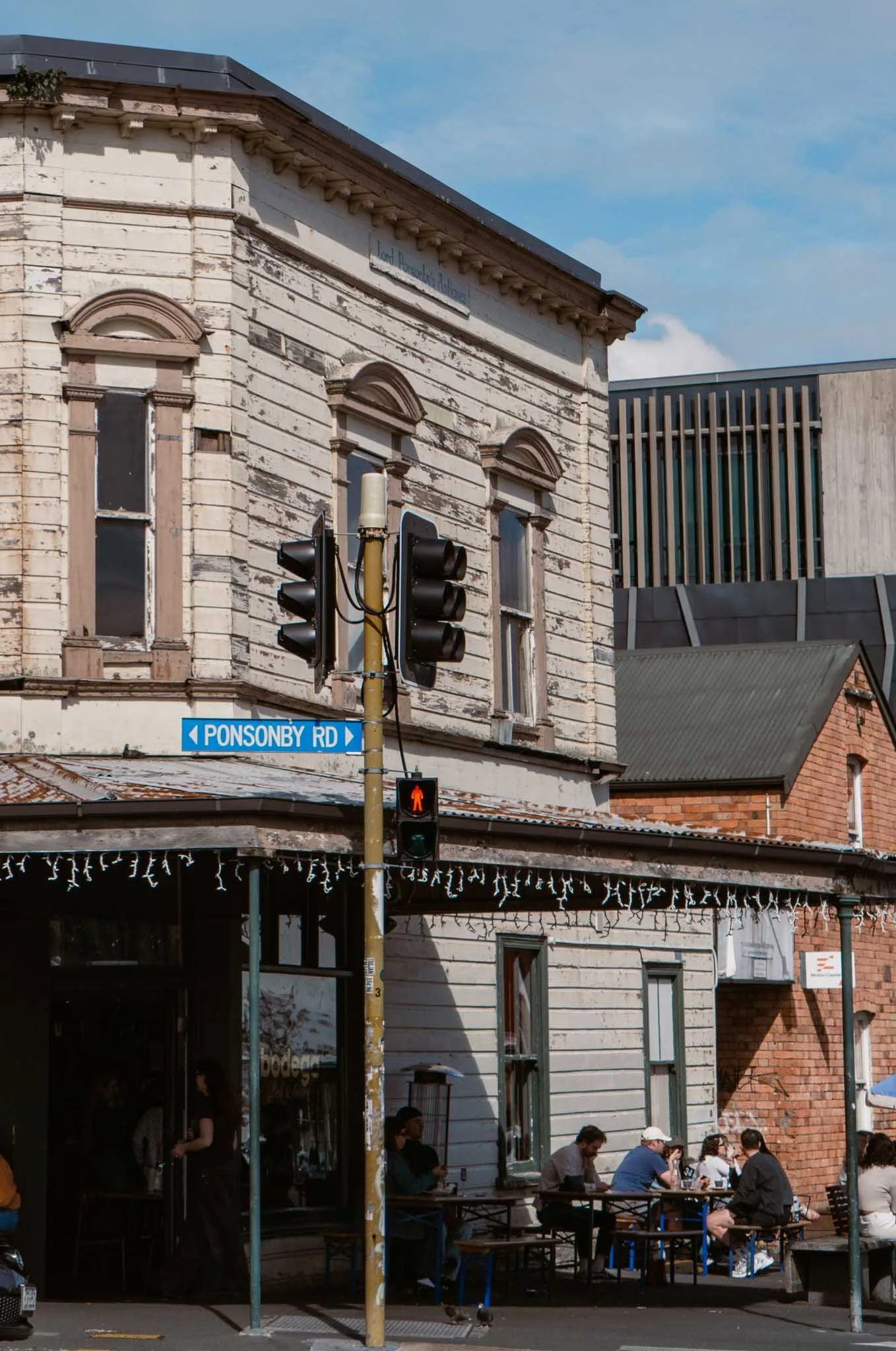A blue street sign reads Ponsonby Road