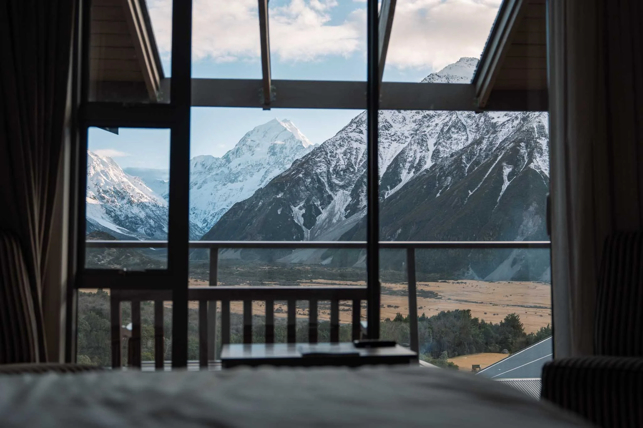 A view of Mount Cook from inside a hotel room at the Hermitage Hotel