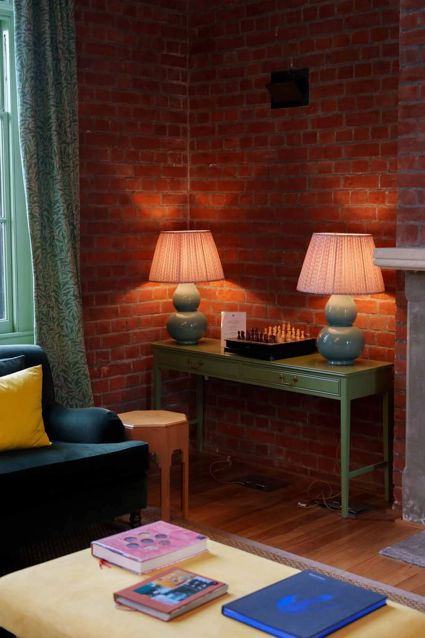Colourful lamps and coffee table books in the lounge at the Observatory Hotel