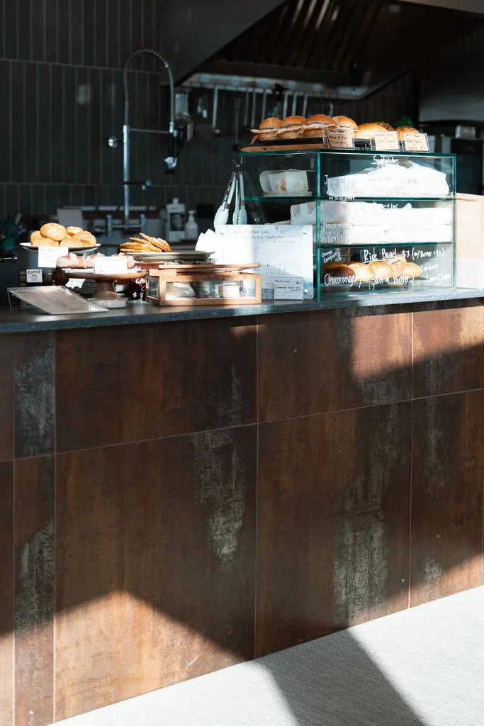 A cabinet of sandwiches and cakes