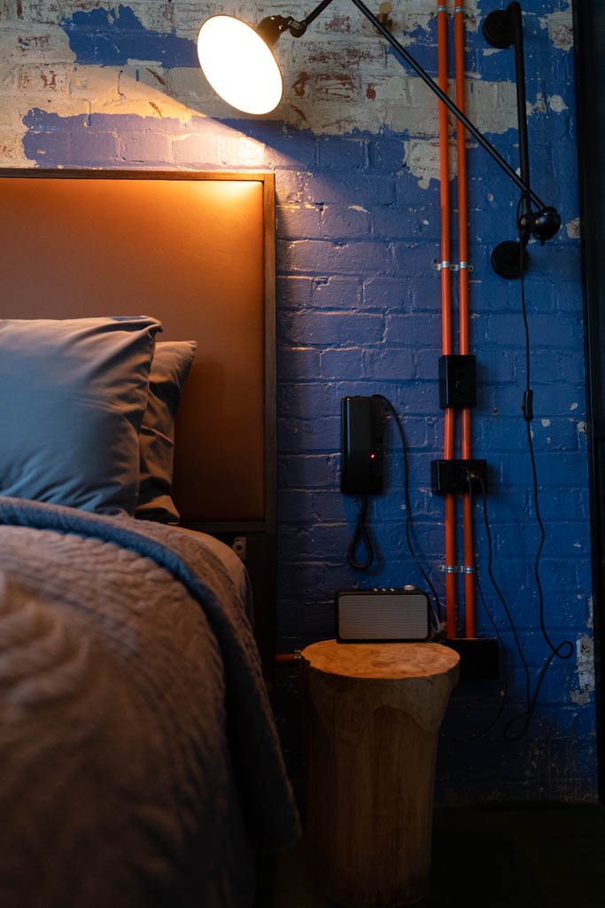 The bedside table in a room at the Intrepid Hotel in Wellington is a stump of wood