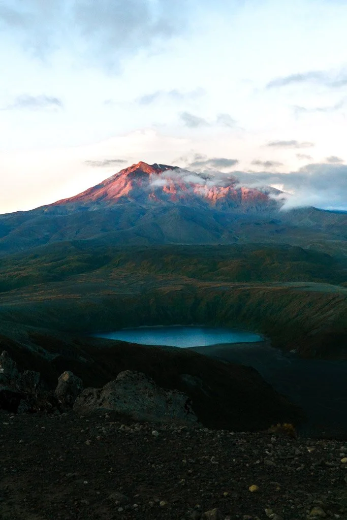 The top of Mount Ruapehu is bathed in pink morning light
