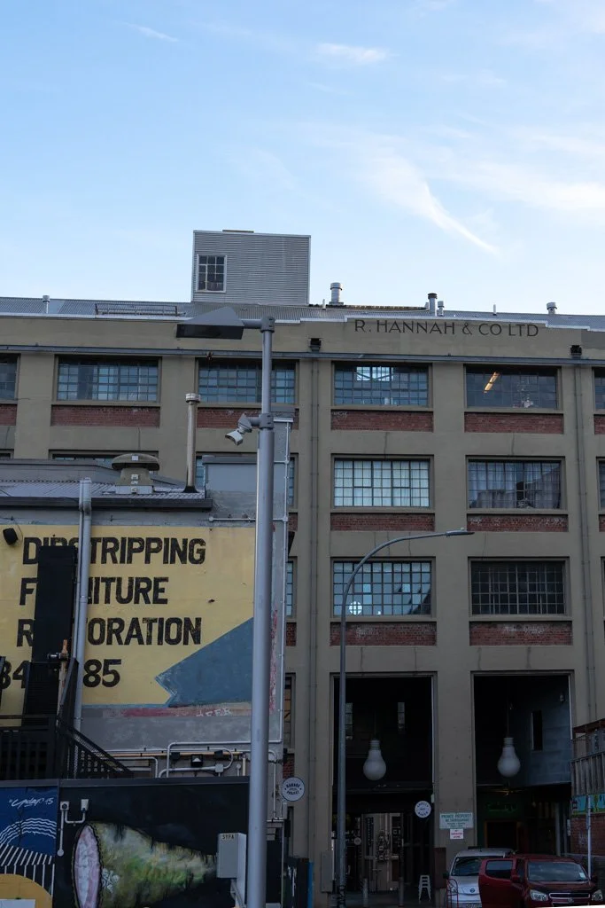 An old building in Wellington with street art on the side