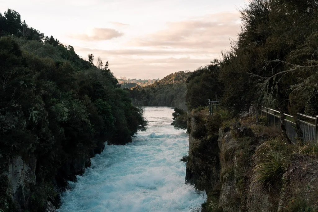 Railing along the top of a cliff overlooking Huka Falls
