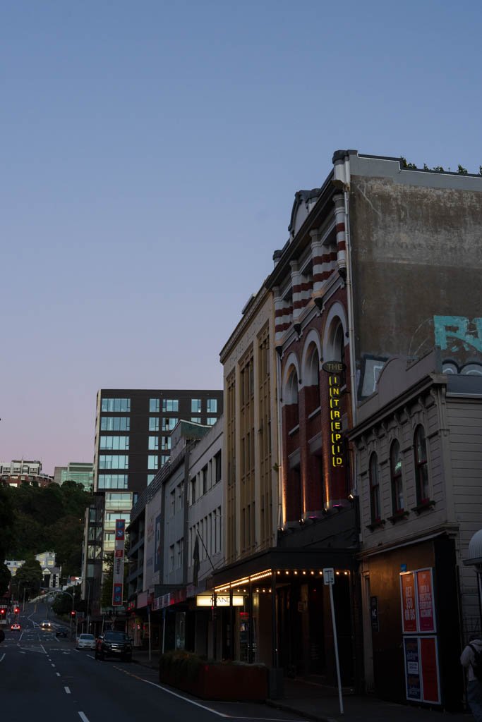 A sign spells out Intrepid on a historic building in Wellington