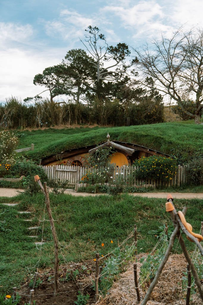 A hobbit hole with a yellow door at Hobbiton