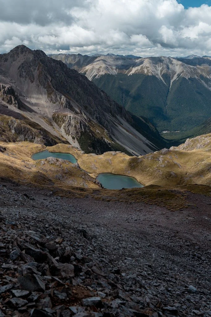 Green mountain lakes against a backdrop of mountains