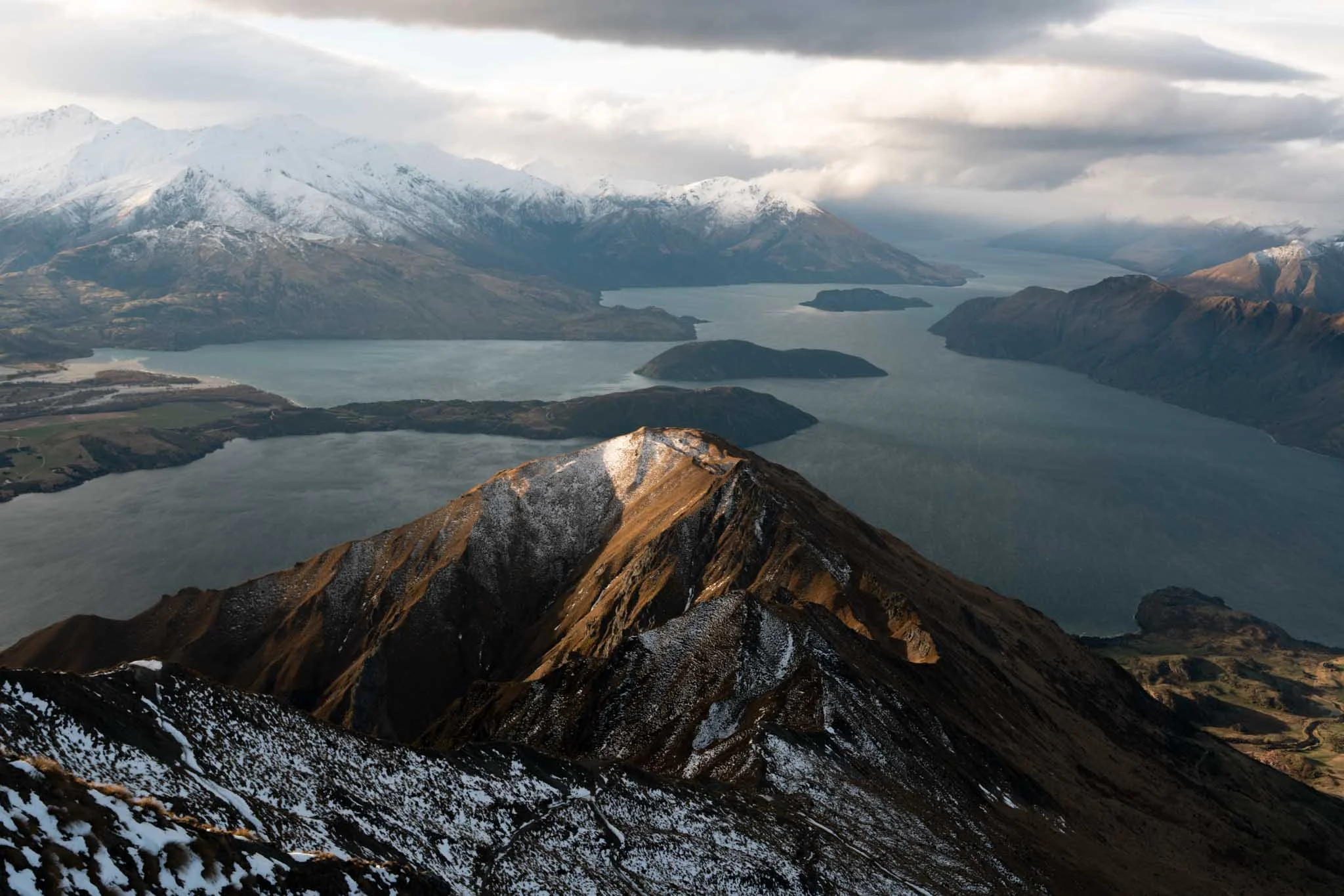 Sunlight touches the top of Roys Peak in Wanaka