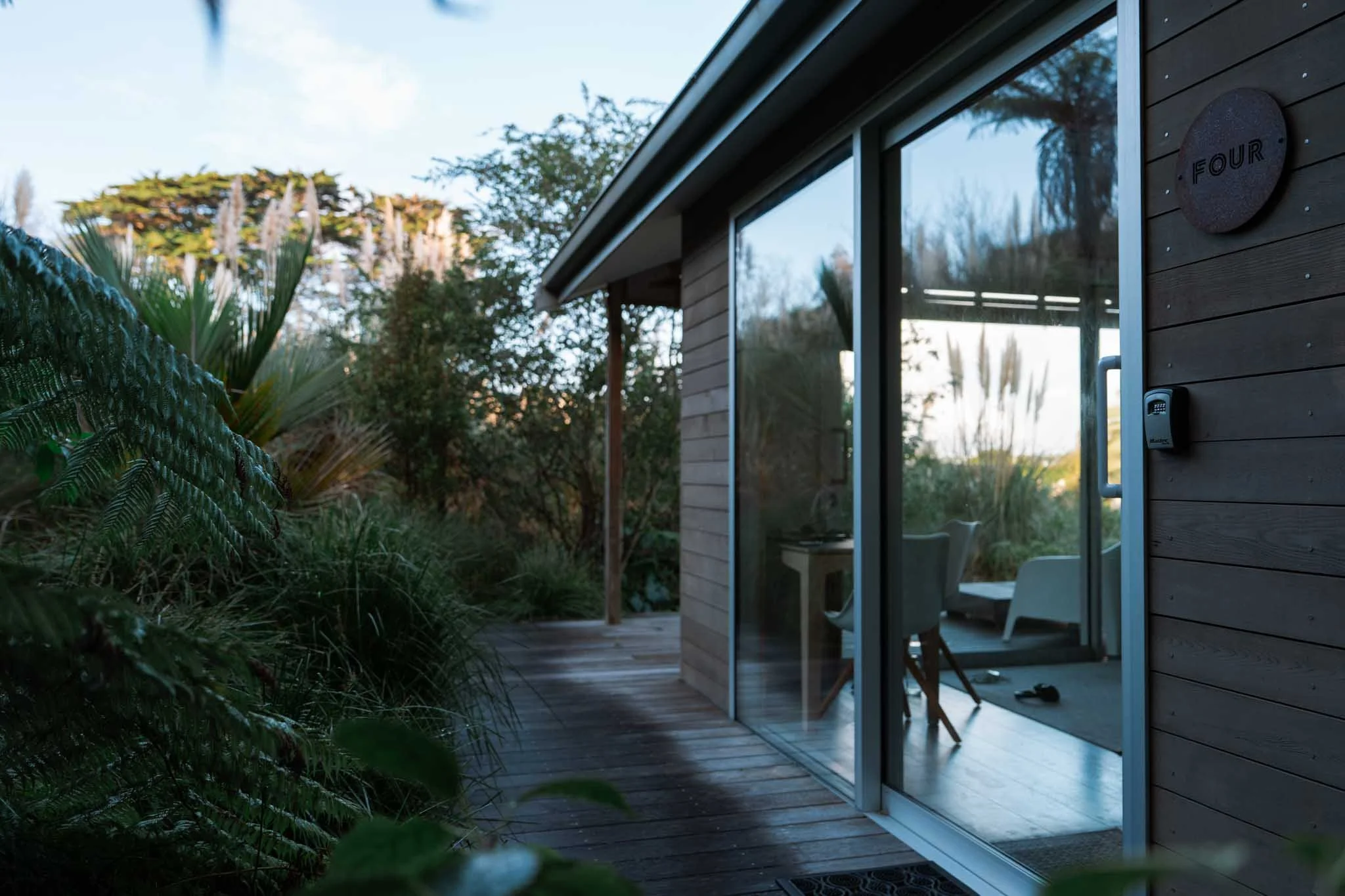 A small cabin hidden in native bush on Waiheke Island