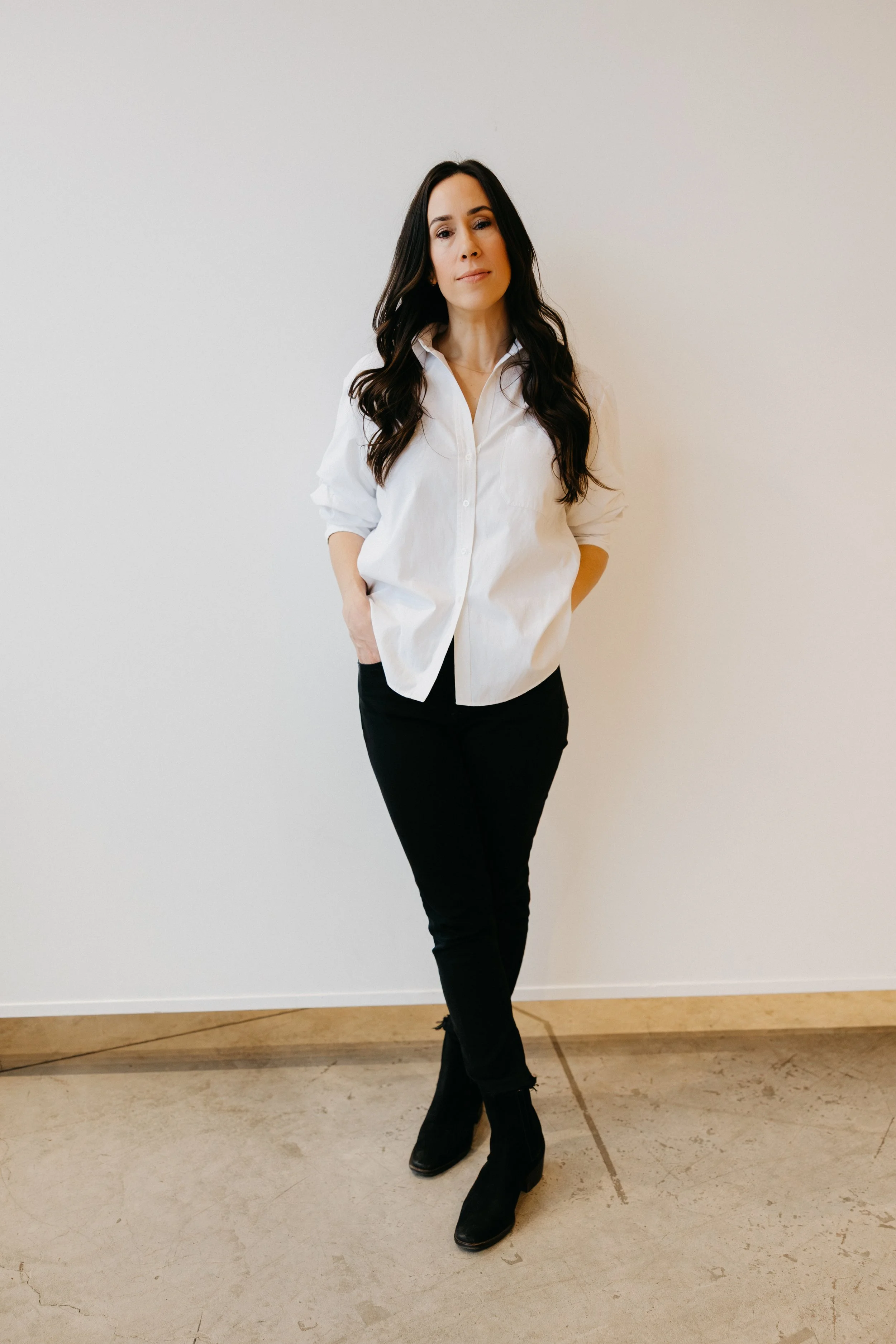 wedding planner photo, white background, black pants,