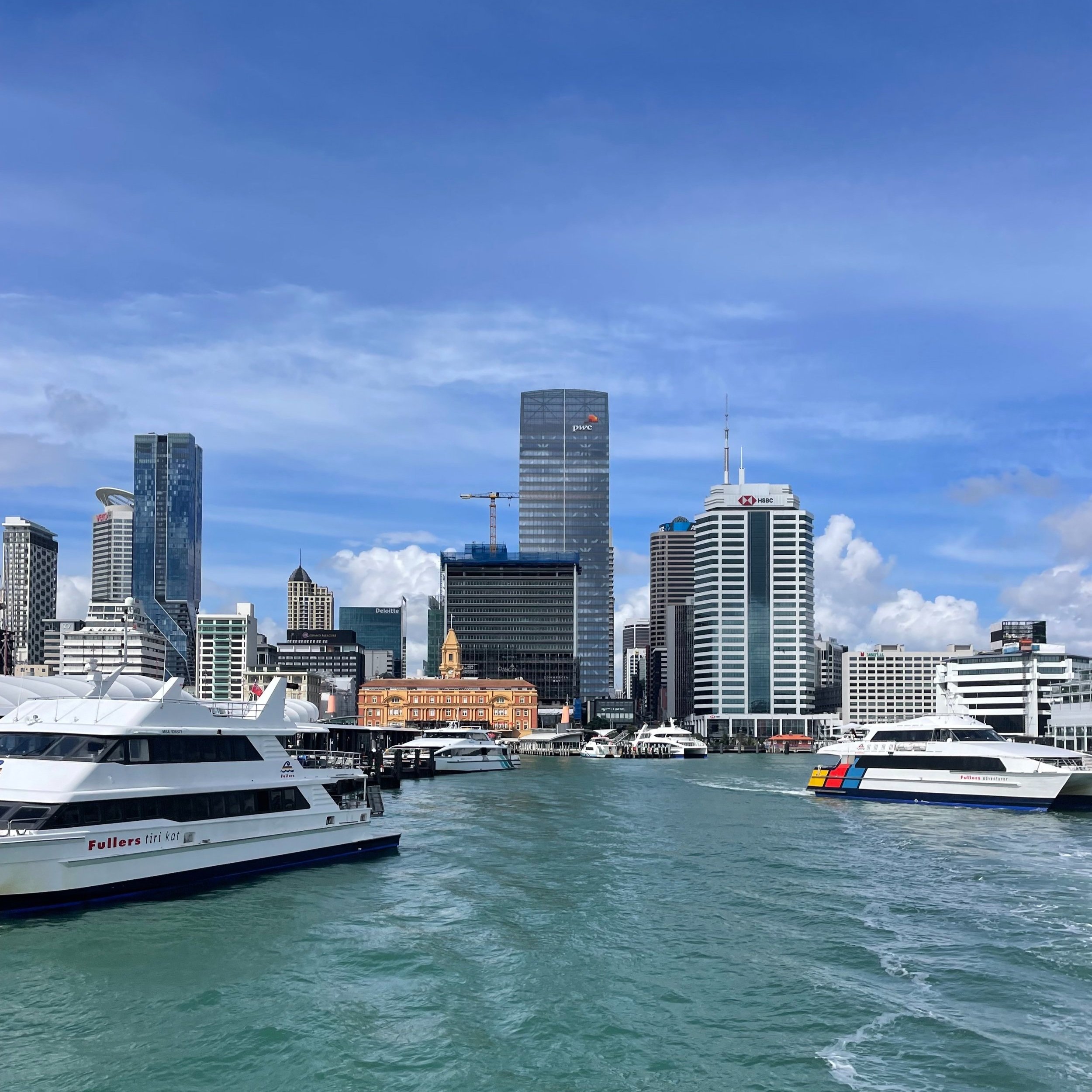 Auckland cityscape with waterfront and ferries