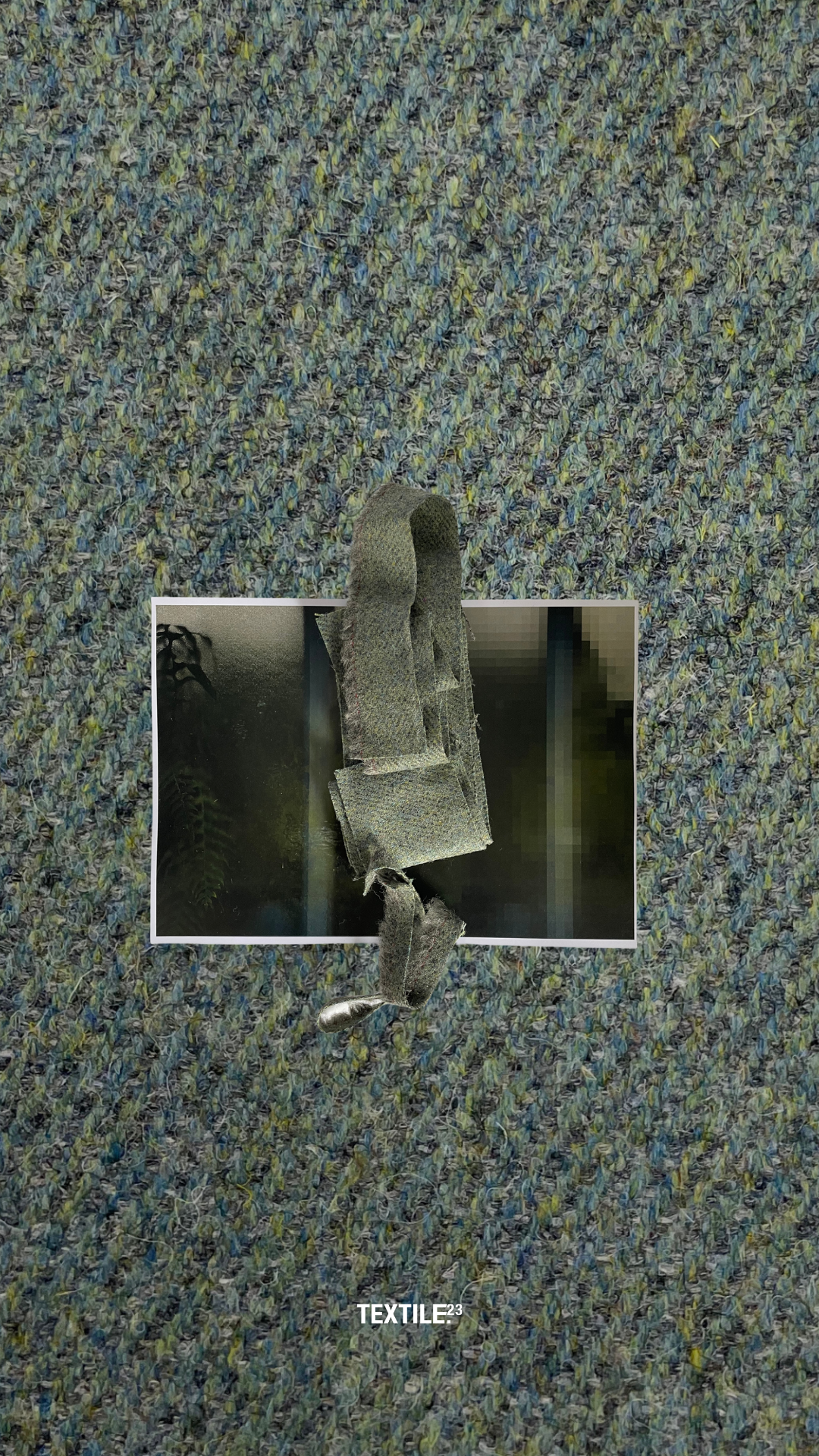 Pixelated image on patterned textile background.