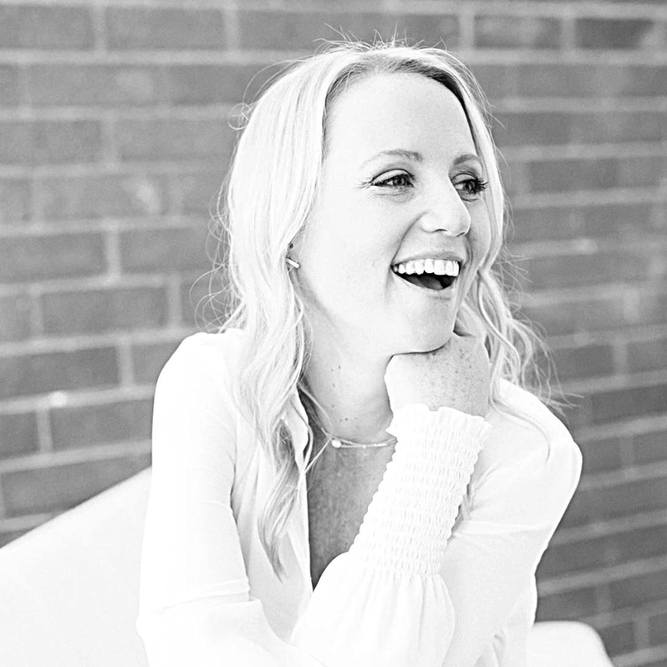 Professional headshot of Charlotte Haigh, in black and white