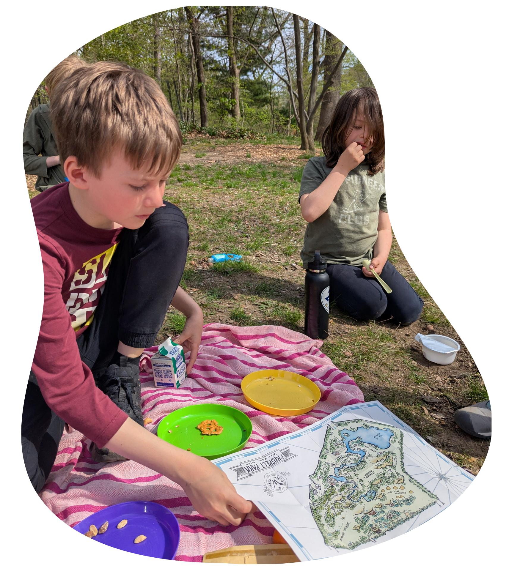 Wonder Kids solving a map-based mission during the Adventurers program outdoors