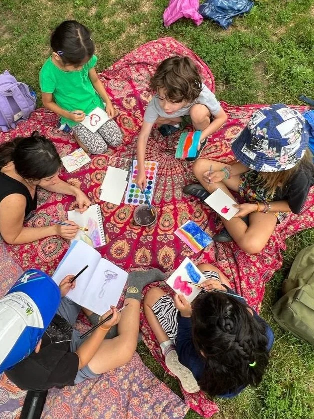 Wonder Kids chatting while doing water colors