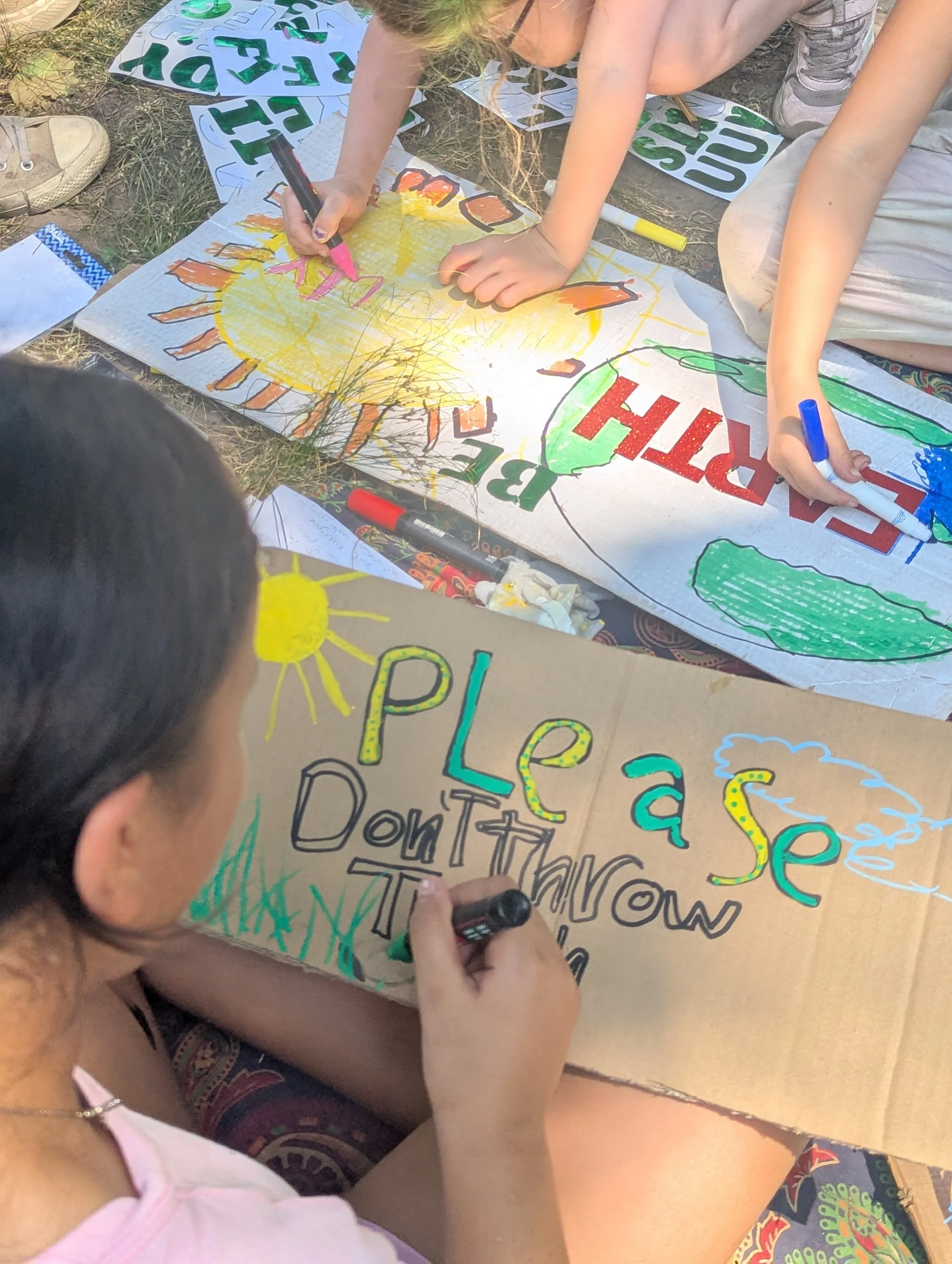 Wonder kids make protect the earth signs