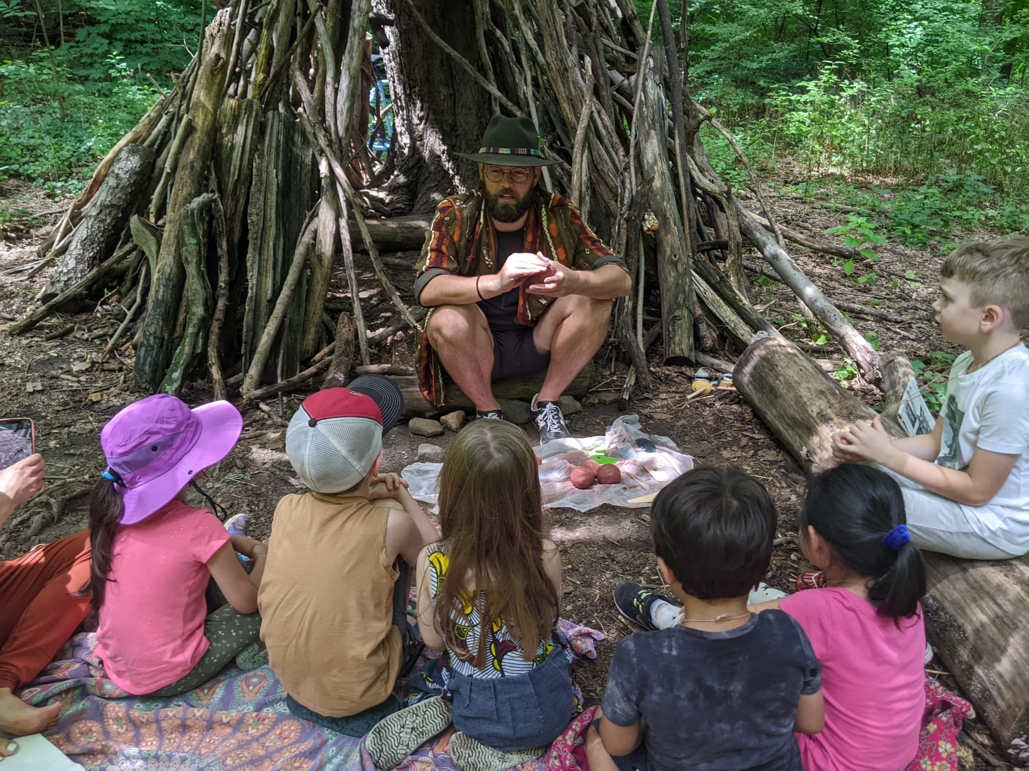 Guest artist teaching a craft with clay to the Wonder Kids