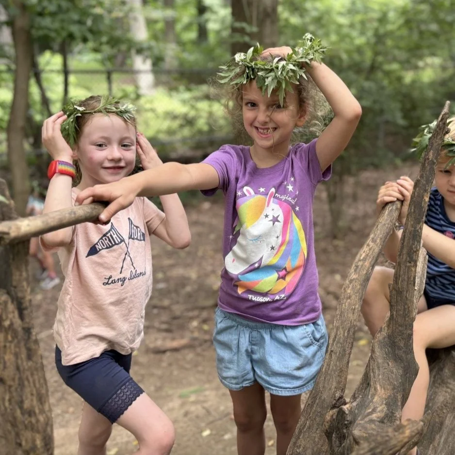 Wonder kids wearing leaf crowns and and holding wonder wands in Prospect Park