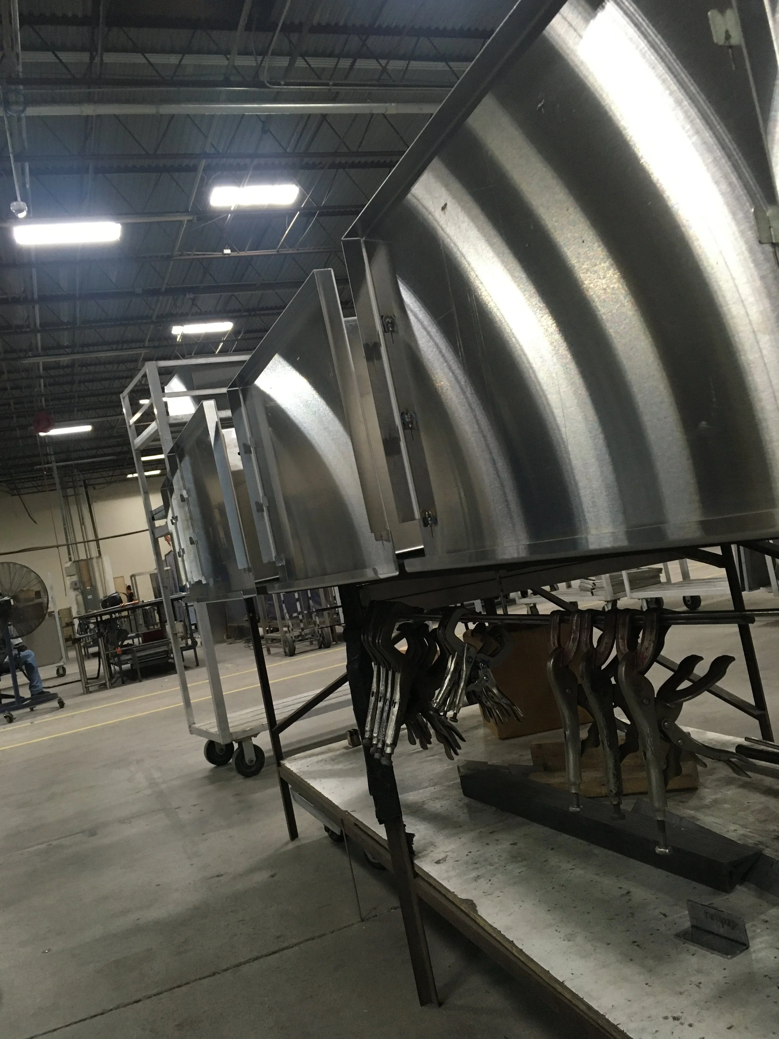 Metal fabrication workshop with industrial equipment and tools