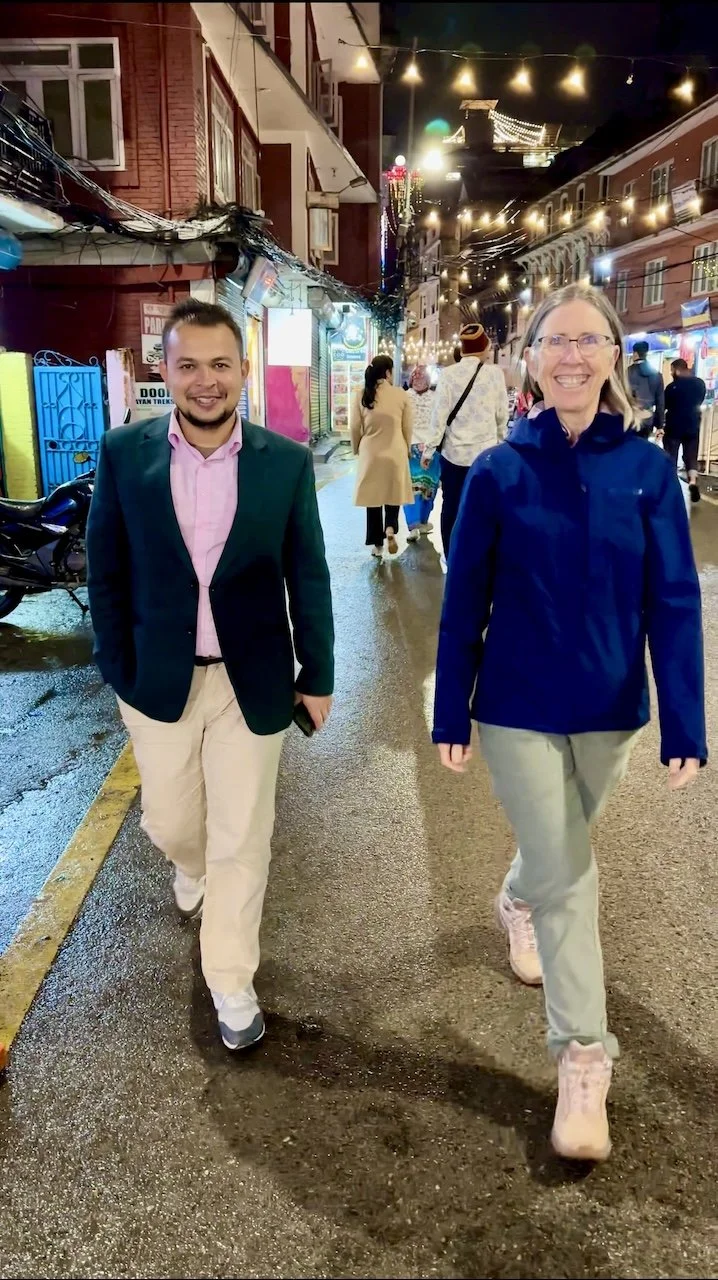 Street scene with smiling man and woman in Kathmandu