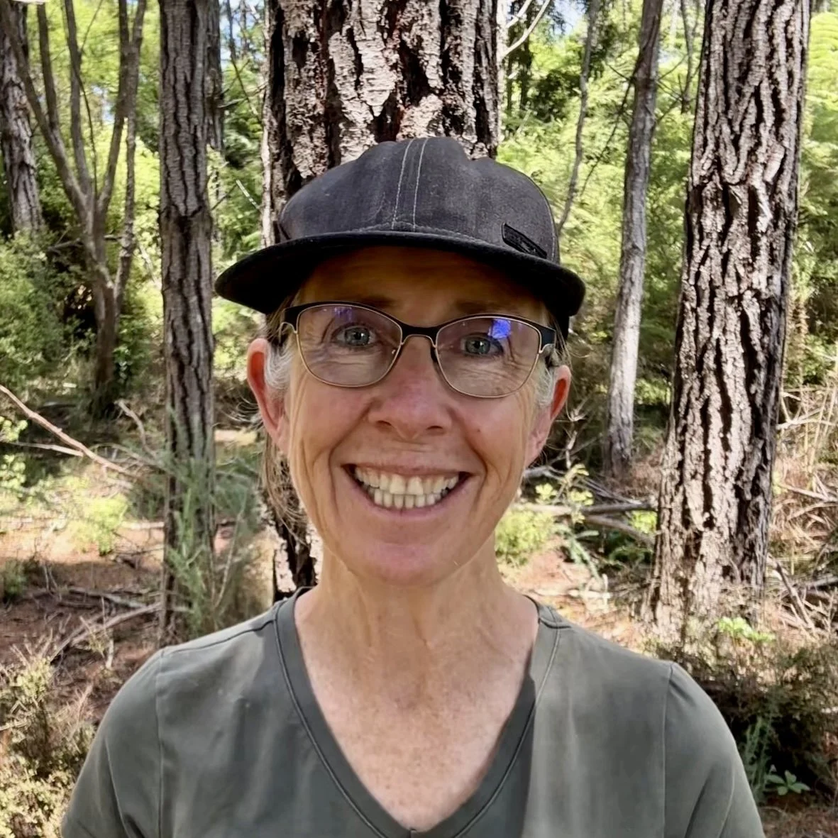Women in Coromandel forest smiling at camera