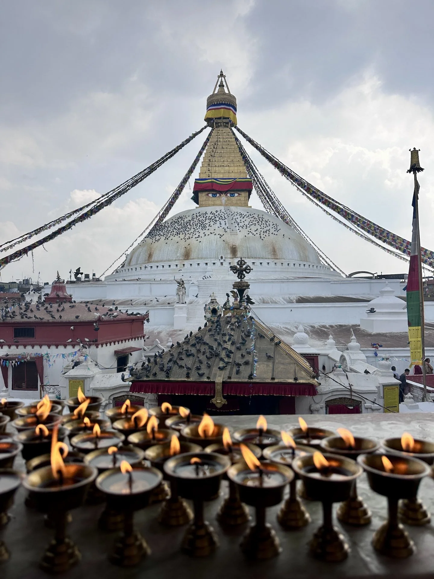 Boudhanath Stupa with butter lamps in the foreground