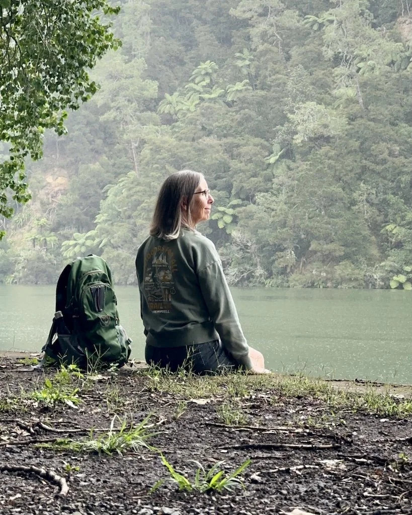 Woman sitting peacefully overlooking the Waikato River