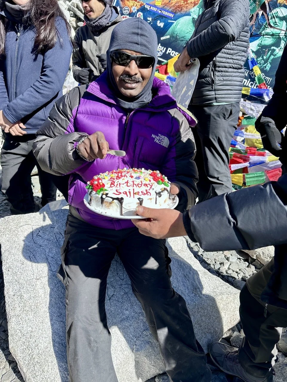 Sailesh celebrating his 50th Birthday with cake at Everest Base Camp