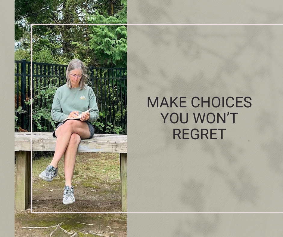Woman journalling while sitting outdoors in a park