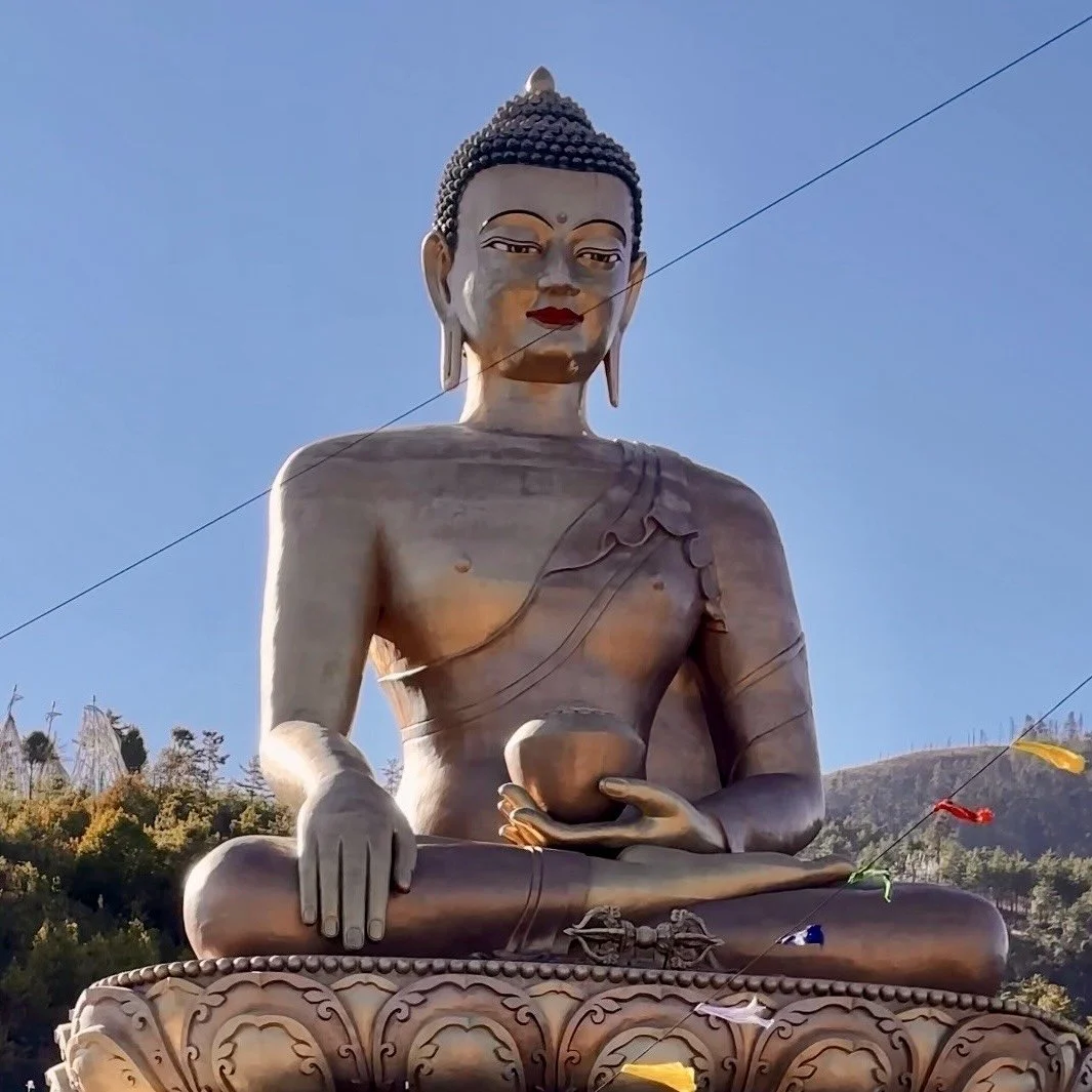 Giant bronze and gold Buddha statue overlooking Thimphu, Bhutan