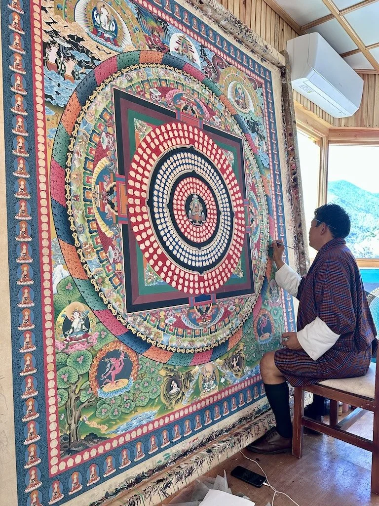 Skilled Bhutan artisans working on painting
